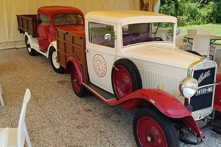 Vintage Italian pickup trucks on display in Modena, part of a private Ferrari Museum visit and balsamic vinegar tasting tour