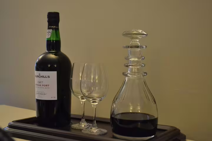 Close-up of vintage port wine bottle and decanter set, emphasizing the quality and elegance of Douro wines.