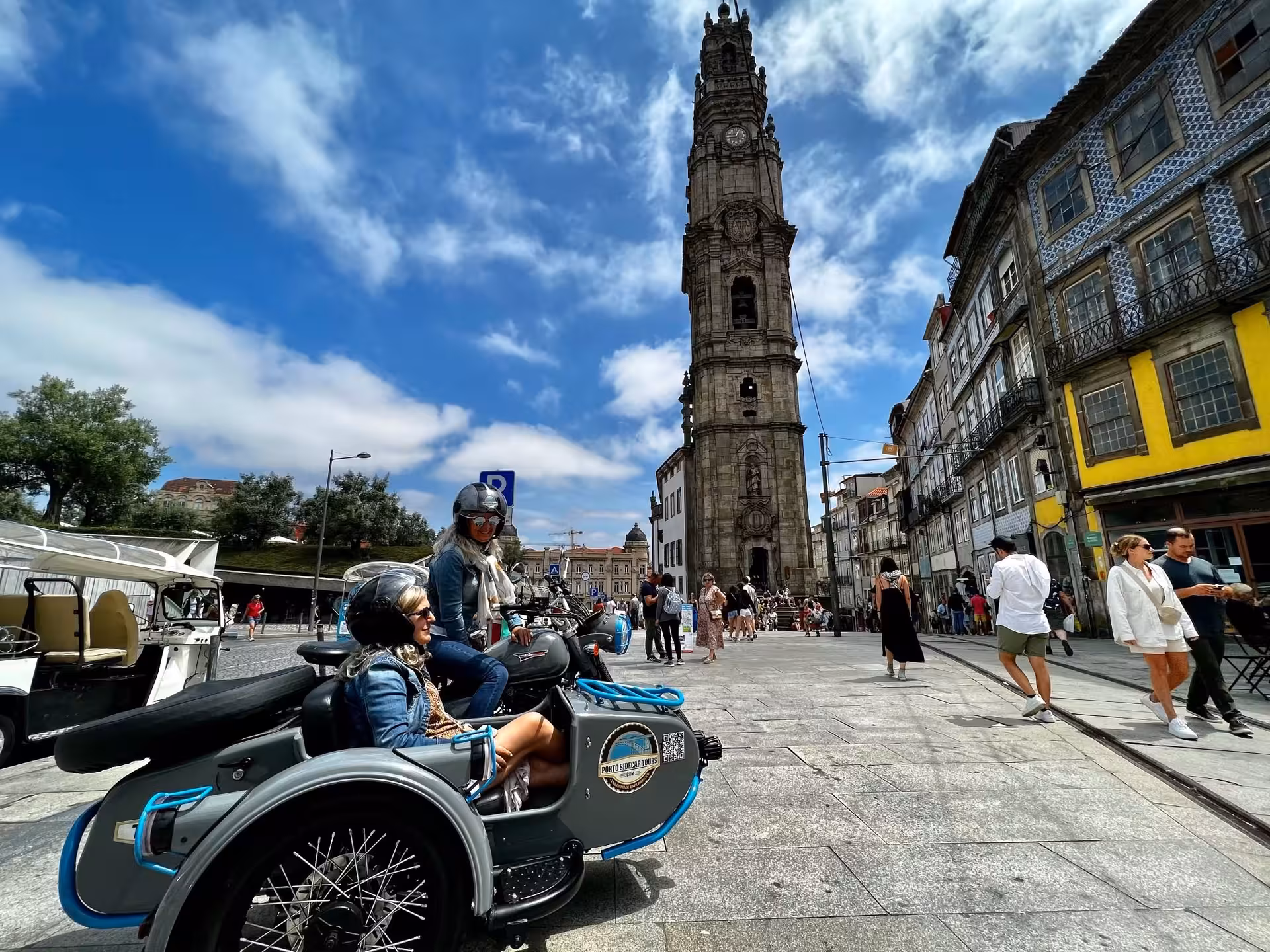 Vintage sidecar tour in Porto at Clérigos Tower, guided afternoon sightseeing ride through historic center