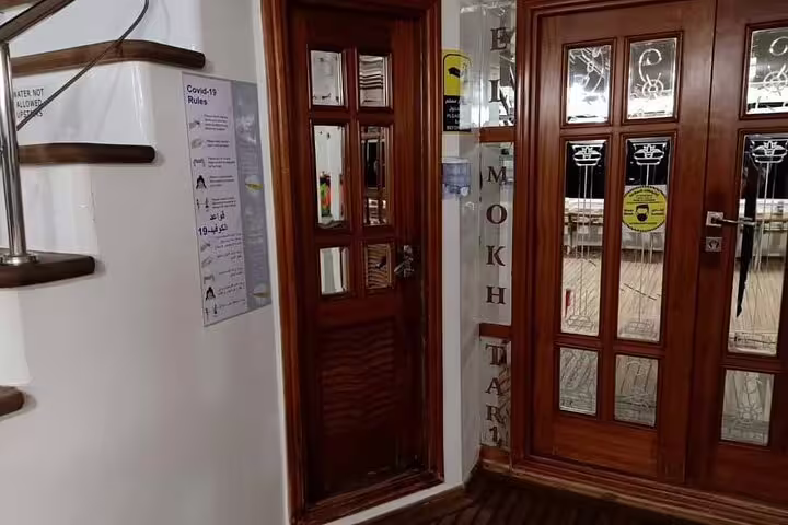 VIP boat interior entrance for Hamata Island snorkeling day trip from Marsa Alam, clean and comfortable cabin