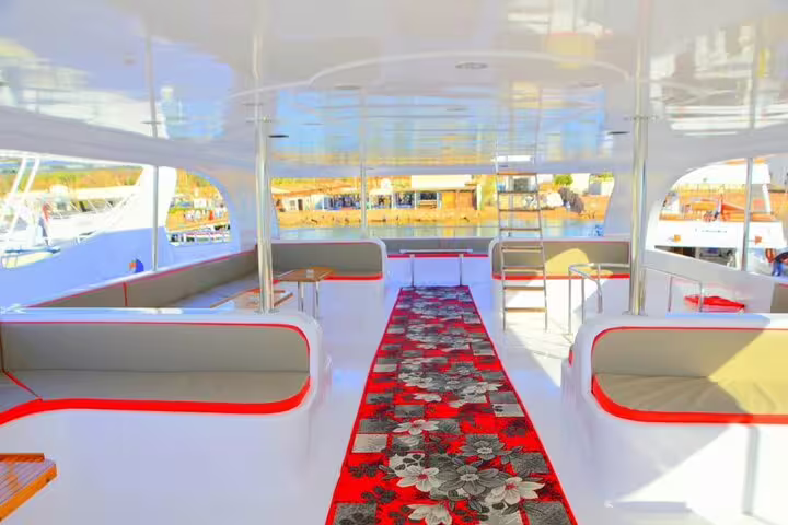 Spacious VIP boat lounge with cushioned seating for private snorkeling day trip to White Island and Ras Mohamed