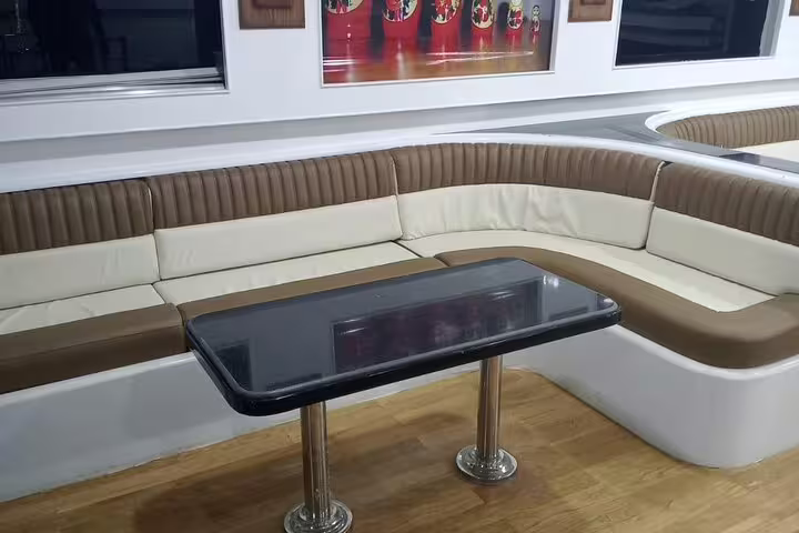 Comfortable VIP boat seating area and table for Marsa Alam Samadai Dolphin House snorkeling tour