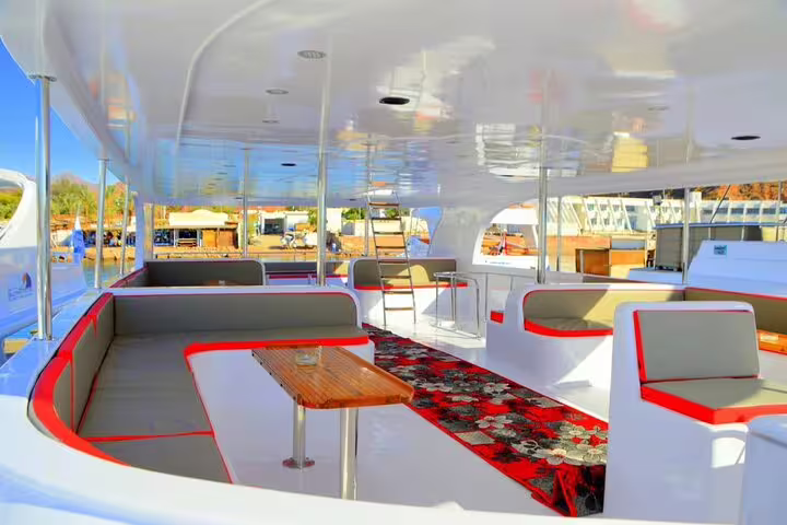 Spacious VIP boat seating and tables for Sharm El Sheikh snorkeling excursion to White Island and Ras Mohamed