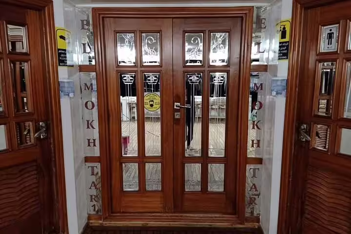 Wooden glass doors inside VIP boat used for Hamata Island snorkeling excursion from Marsa Alam in the Red Sea
