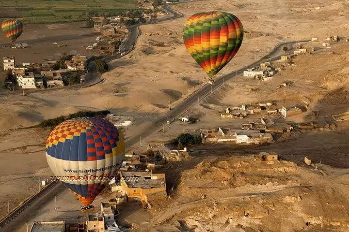 VIP Luxor hot air balloon ride with hotel pickup, flying over West Bank villages and desert at sunrise