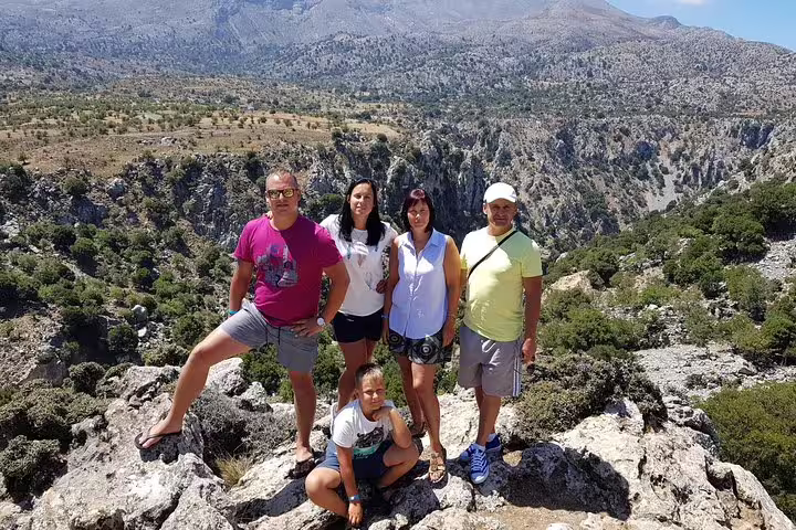 Group of tourists enjoying a panoramic mountain view during a VIP luxury private 4x4 tour.