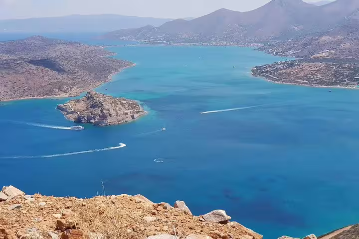 Breathtaking aerial view of a turquoise bay and scenic coastline, ideal for a VIP luxury Land Rover 4x4 excursion.