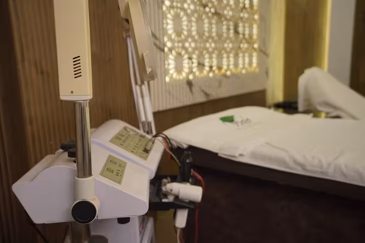 Spa steam machine beside massage bed in Sharm El Sheikh wellness center for VIP solo massage experience