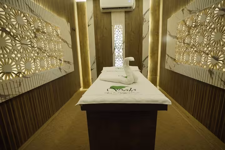 Private VIP solo massage room in Sharm El Sheikh spa with treatment bed, warm lighting and towel swan