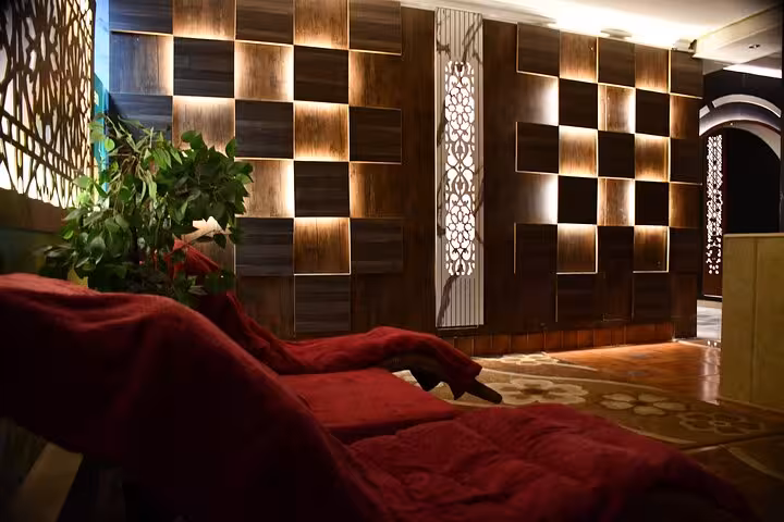Luxury spa lounge with red recliners, perfect for VIP solo massage experience in Sharm El Sheikh