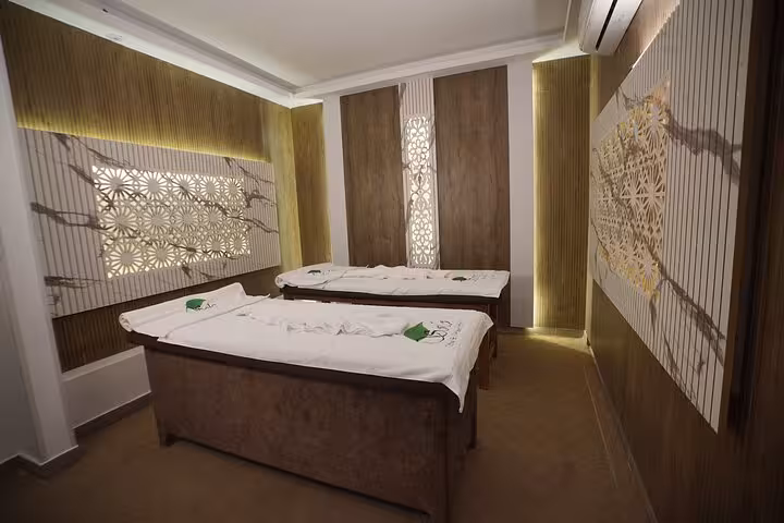 Luxury Sharm El Sheikh spa suite with two massage beds, soft ambient lighting for VIP solo massage experience