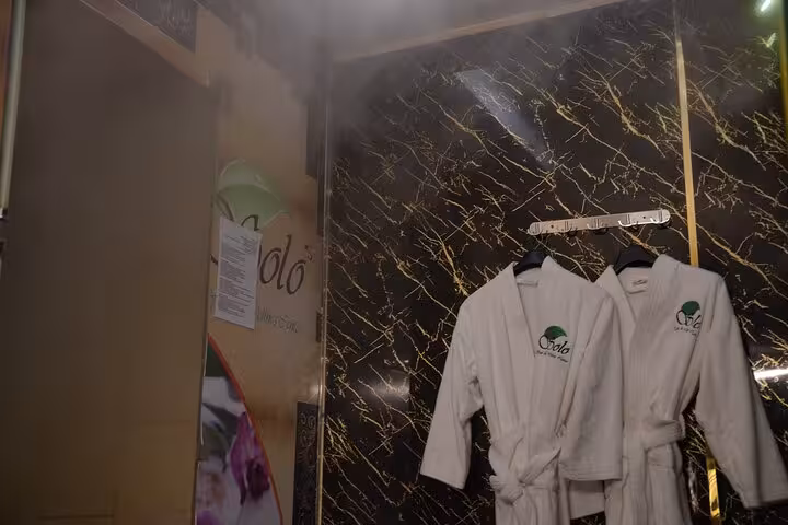 Spa robes hanging in a steam room, VIP solo massage experience in Sharm El Sheikh wellness center