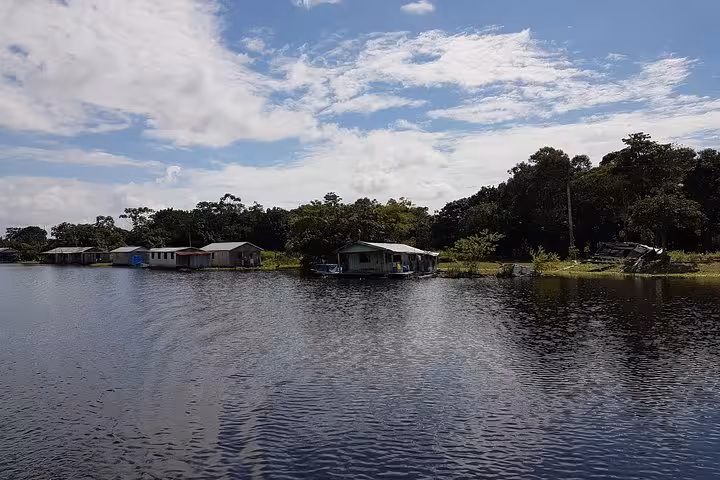 Riverside Amazon village houses along the Santa Rosa border route to Iquitos by VIP speedboat