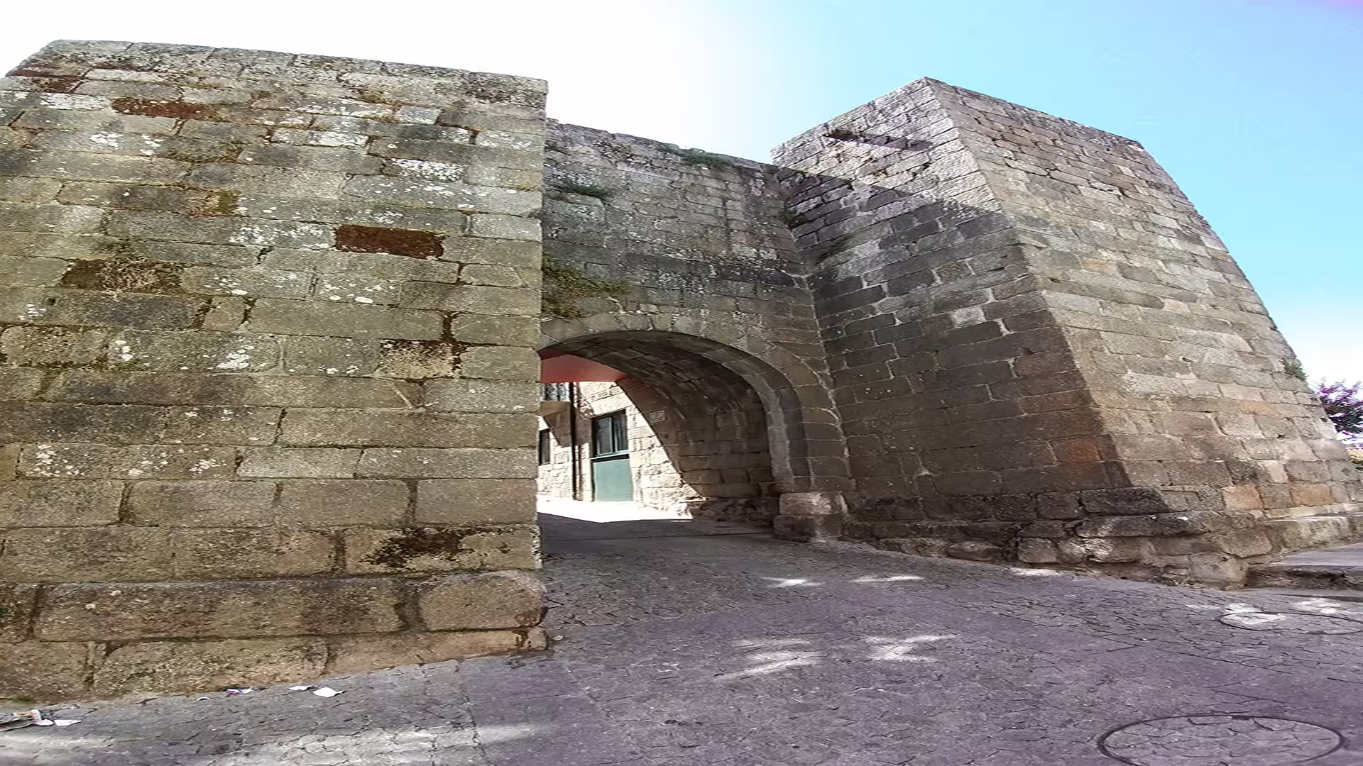 Ancient stone archway in Viseu, Portugal, showcasing historic architecture on a private tour of Lamego and the Dão wine region.