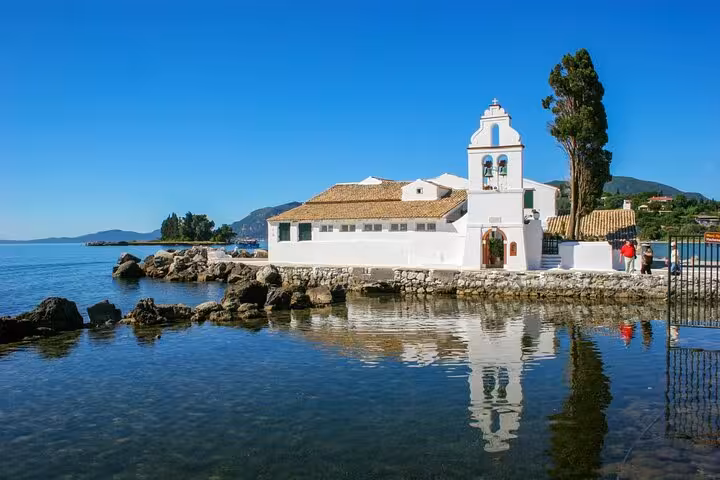 Vlacherna Monastery at Kanoni with calm sea reflections, iconic landmark on Top 5 of Corfu tour