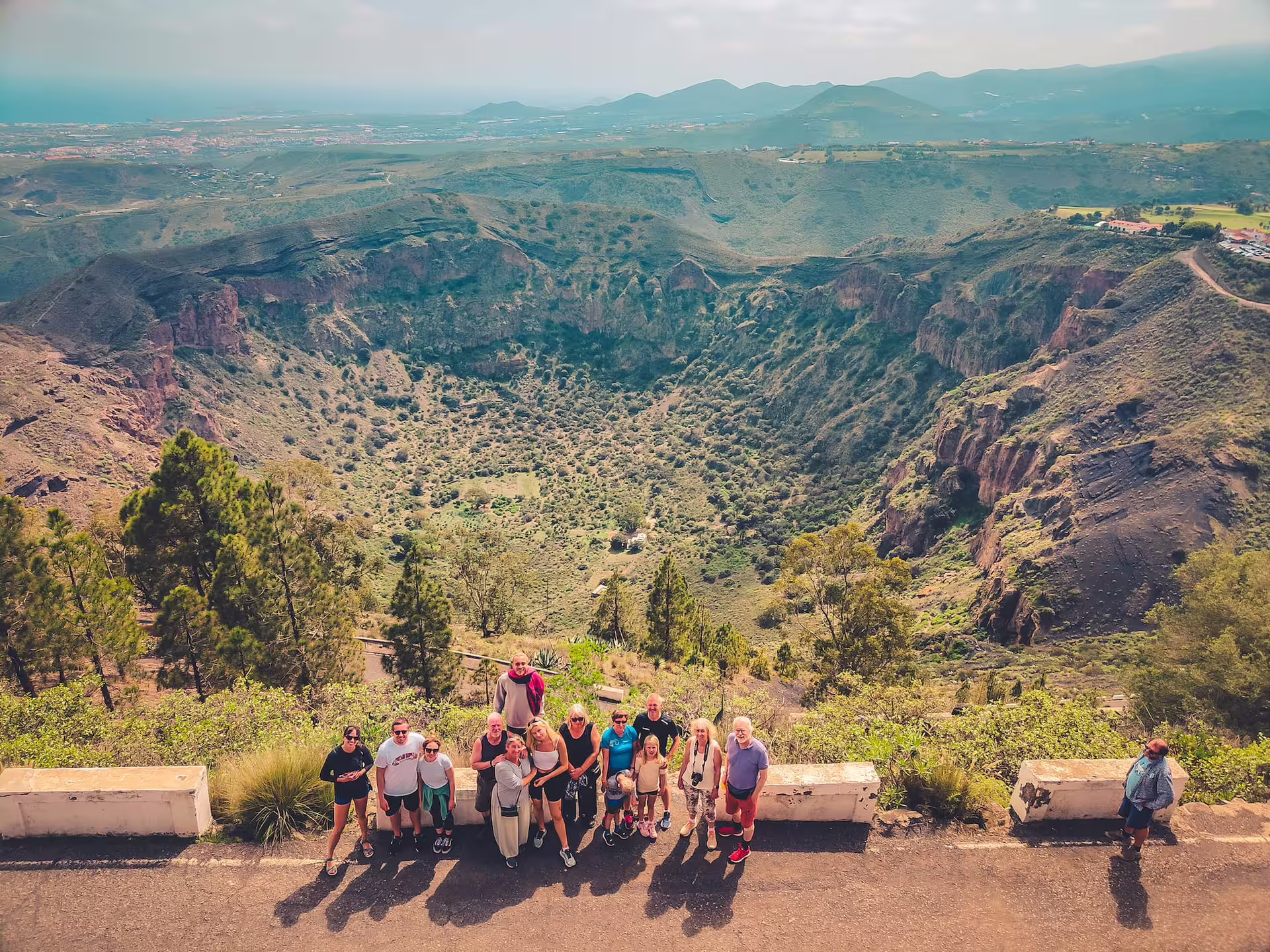 Group enjoying breathtaking views of a volcanic crater on the Volcano Heart Tour, perfect for adventure seekers.
