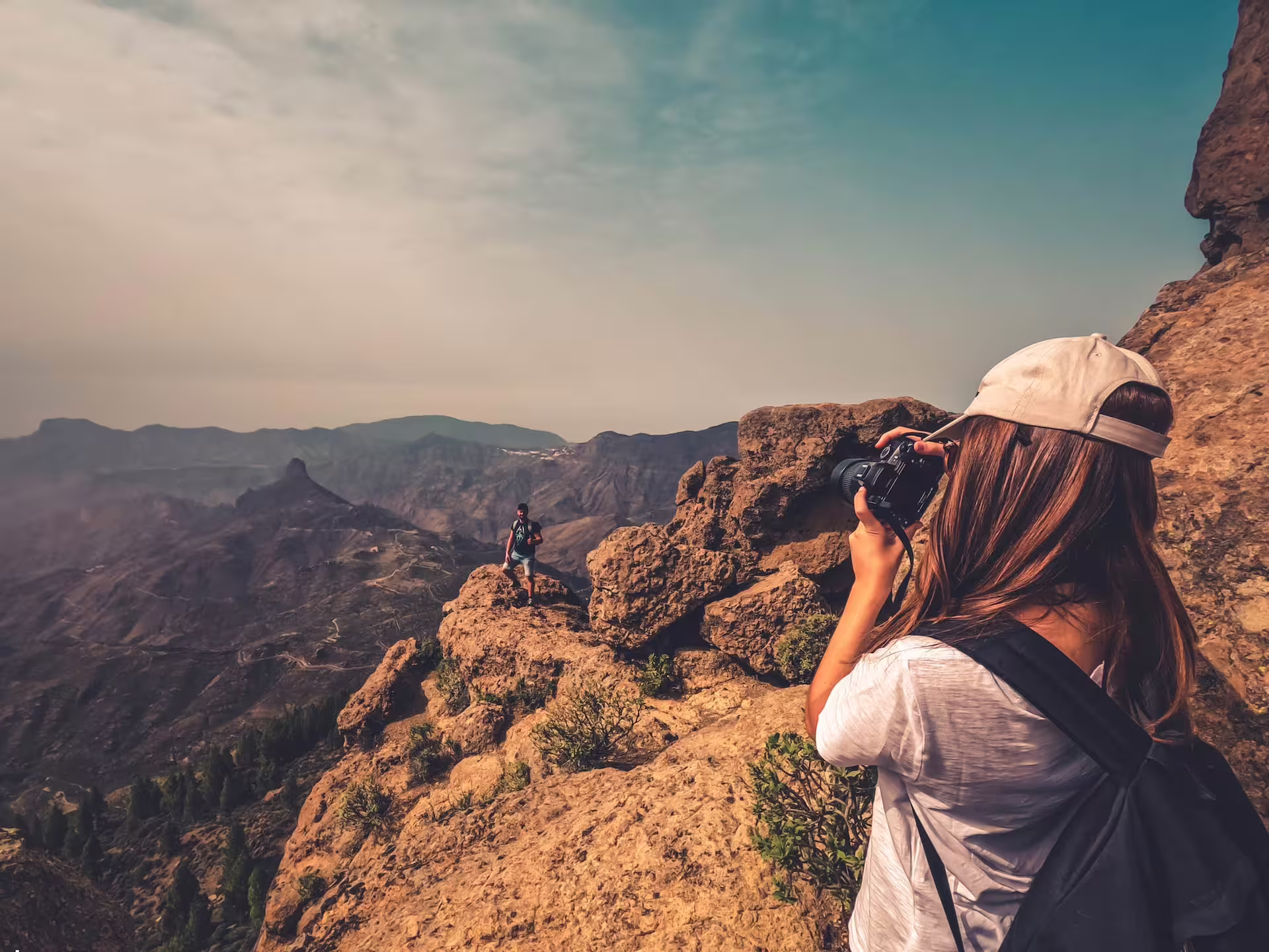 Photographer captures stunning volcanic landscape on Volcano Heart Tour, highlighting rugged cliffs and expansive vistas.