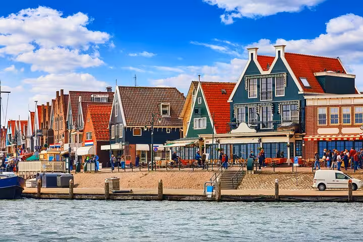 Waterfront street in Volendam with classic Dutch houses on a private Zaanse Schans & Volendam tour