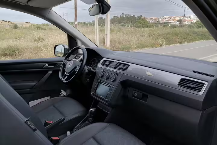 Interior of Volkswagen Caddy showcasing comfortable seating for private transfers from Faro to Lagos and beyond.