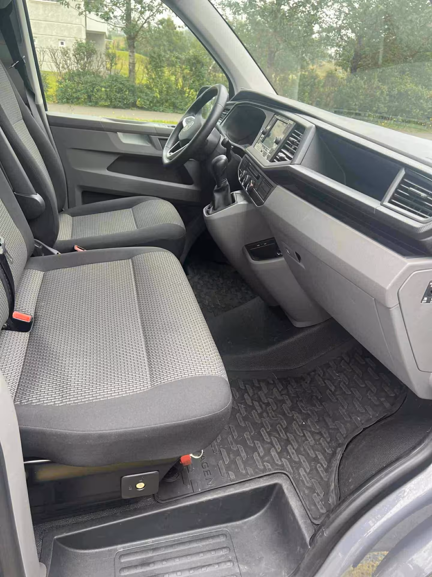 Spacious Volkswagen van cabin for Grand Golden Circle tour from Reykjavik, modern seating for Iceland excursions