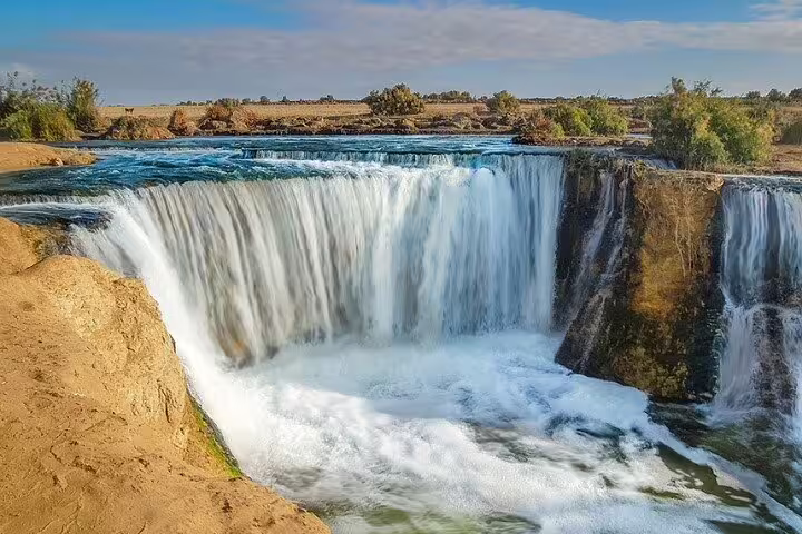 Wadi El Rayan waterfall in El Fayoum Oasis on an overnight camping tour from Cairo, Egypt desert scenery