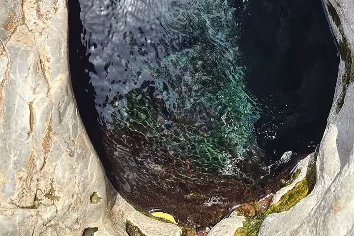 A deep, serene rock pool in Wakan offers a tranquil experience on the 2 Days 1 Night Wakan Private Tour.