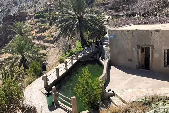 Scenic view of Wakan Village with traditional architecture and lush greenery on a 2-day private tour.