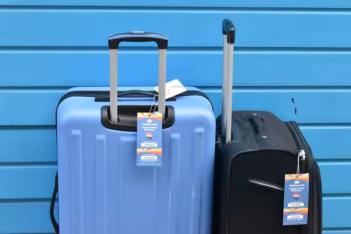 Suitcases with Stasher tags ready for Warsaw Old Town luggage storage, secure bag drop for city sightseeing