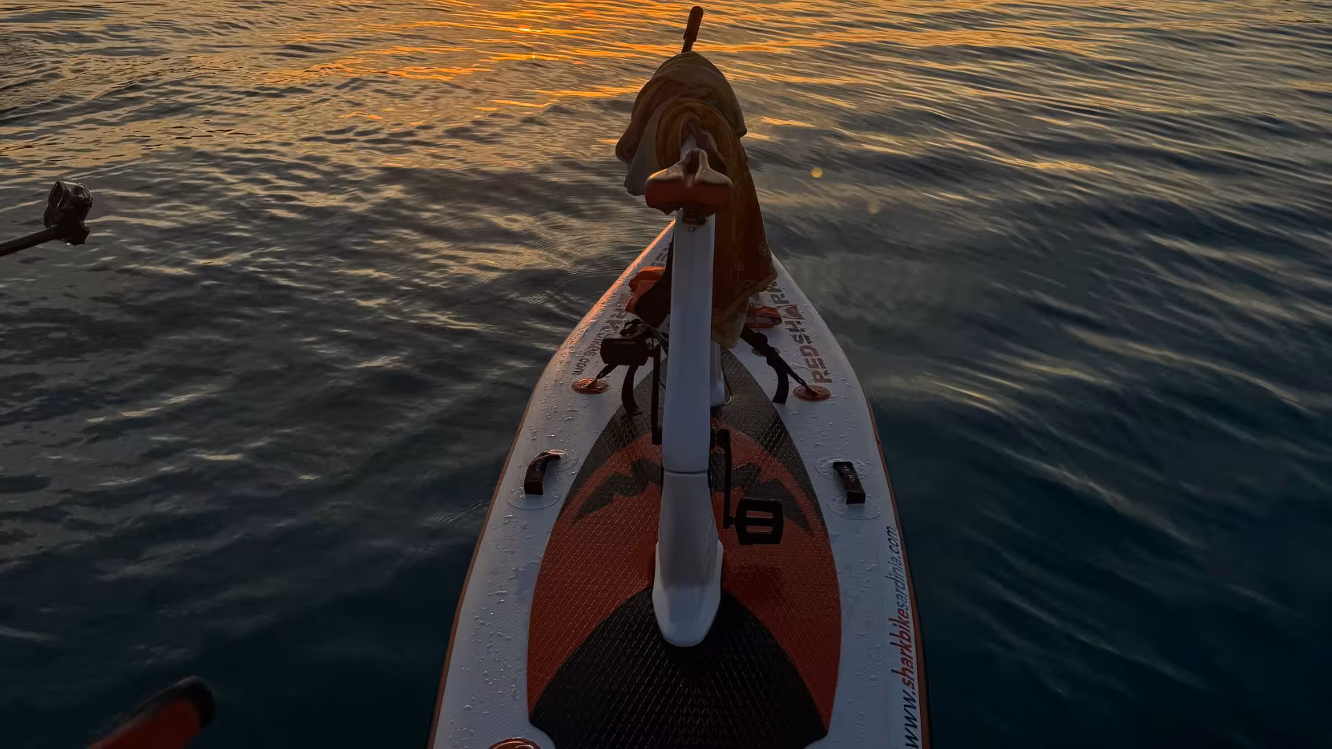 Close-up view of a water bike during a sunset excursion on the tranquil waters of La Pelosa, Stintino.