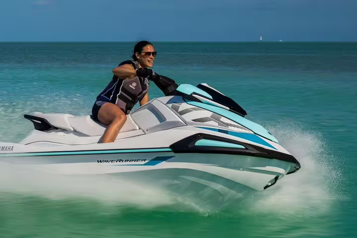 Rider speeding on a WaveRunner in Ibiza waters on a guided jet ski tour to Cala Comte beach