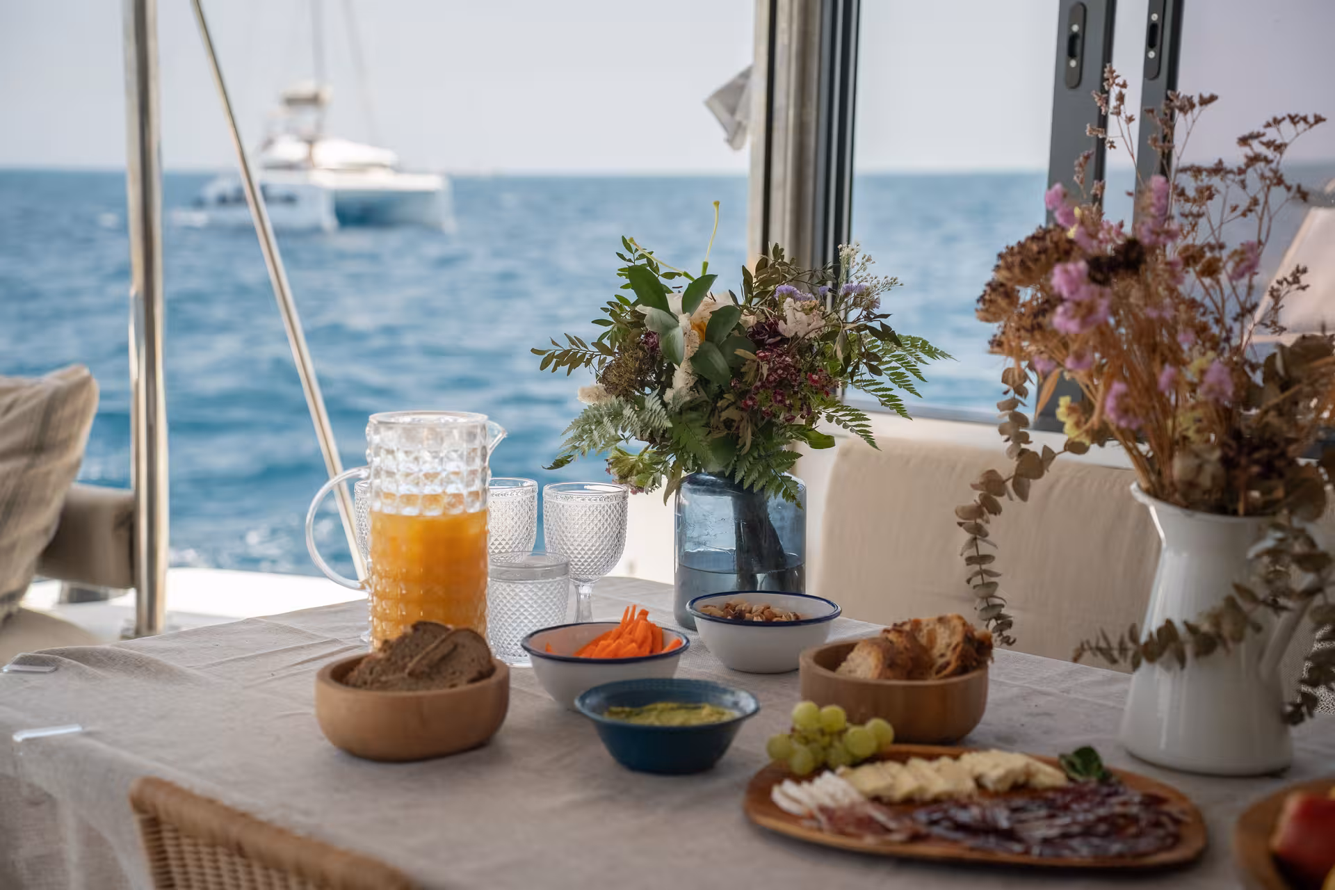 Healthy brunch table on a yacht with sea view, Wellness & Sea Breeze sailing retreat with fresh drinks