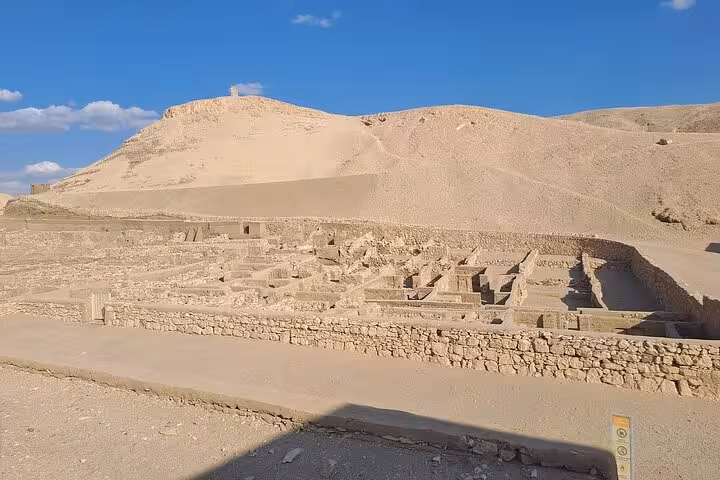 Ancient archaeological ruins against a desert backdrop on the West Bank Luxor tour.