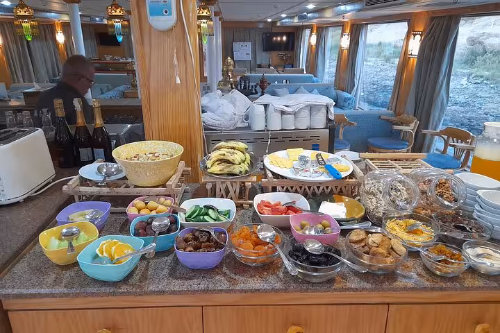 Enjoy a luxurious breakfast spread aboard a Nile cruise during your West Bank Luxor day tour.