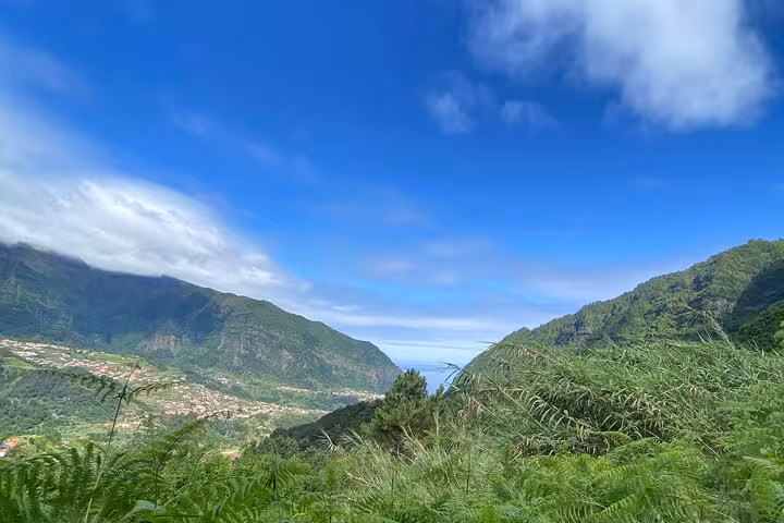 Panoramic valley and ocean view from West Madeira 4x4 route, lush mountains en route to Fanal Forest skywalk