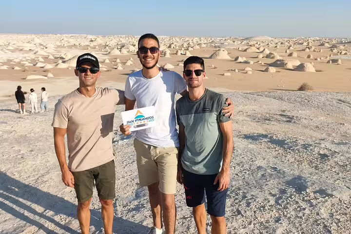 Friends at White Desert viewpoint on private 2-day Bahariya Oasis jeep safari, Egypt chalk rock landscape
