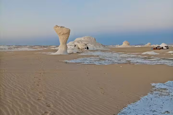 Mushroom-shaped chalk rock and sand dunes in Egypt’s White Desert on a private 4-day Bahariya tour