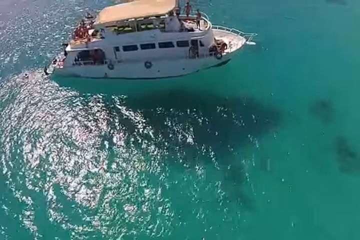Aerial view of tour boat cruising turquoise Red Sea on White Island and Ras Mohammed cruise with lunch