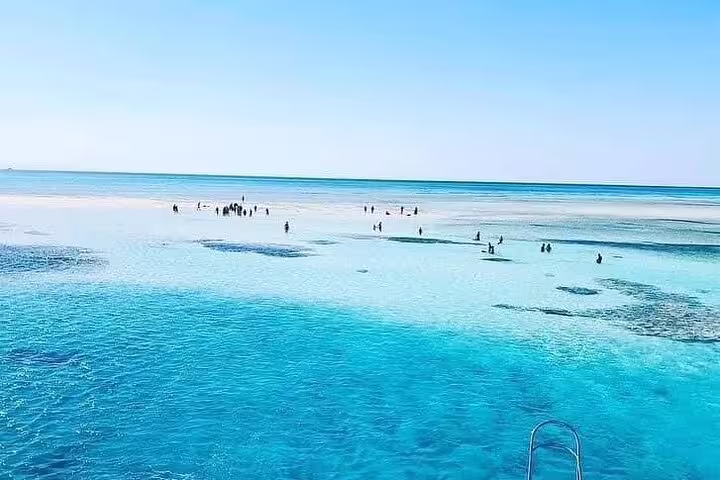 White Island sandbar stop on VIP boat snorkeling tour from Sharm El Sheikh, shallow turquoise Red Sea lagoon