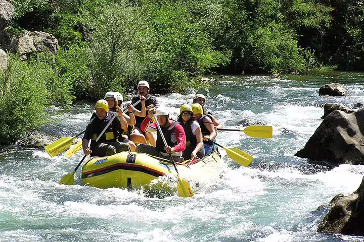 Group white-water rafting on Cetina River near Makarska Riviera, paddling rapids with transfer included