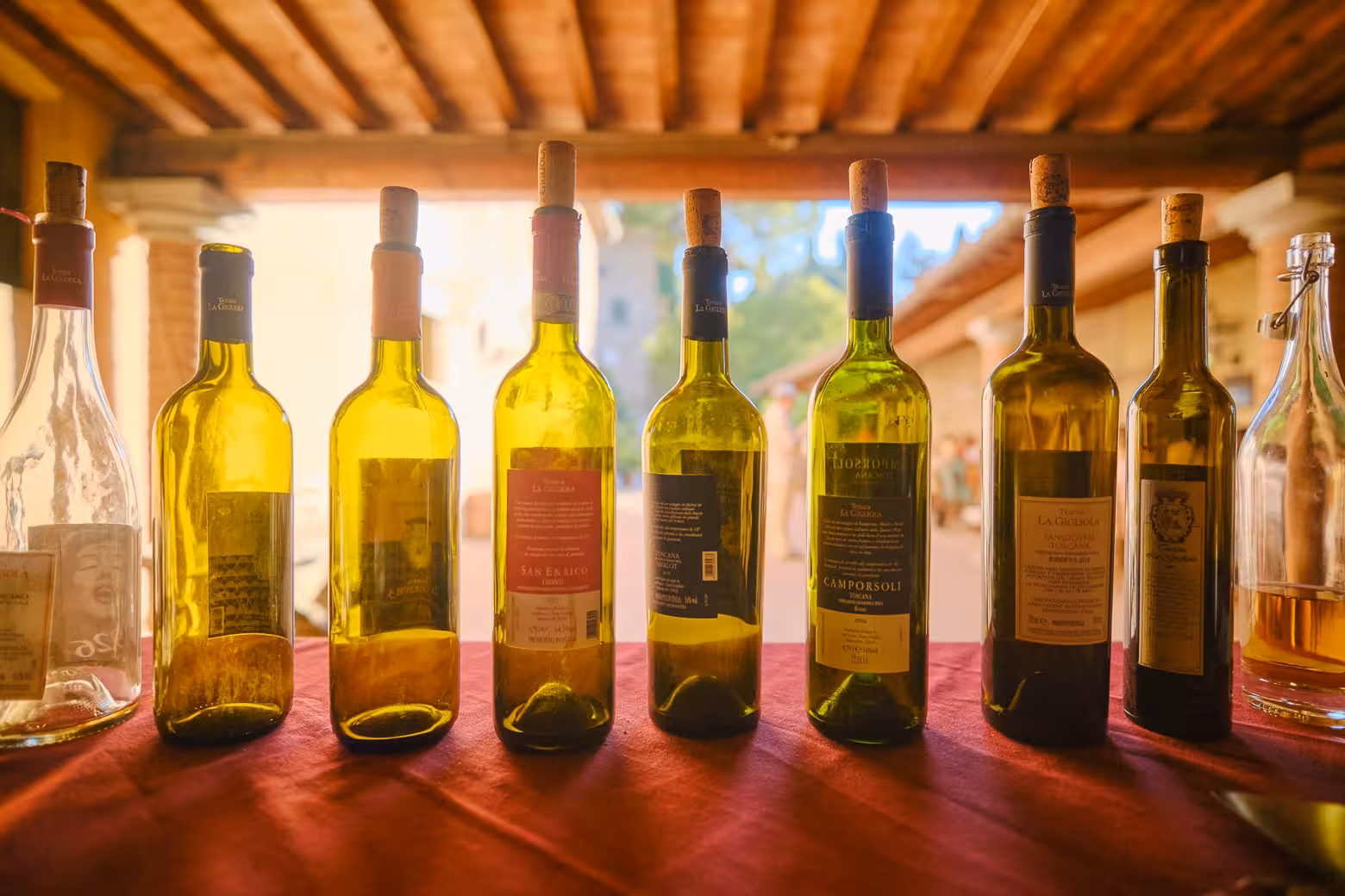 Assorted wine bottles displayed elegantly on a table, highlighting a personalized wine blending experience.