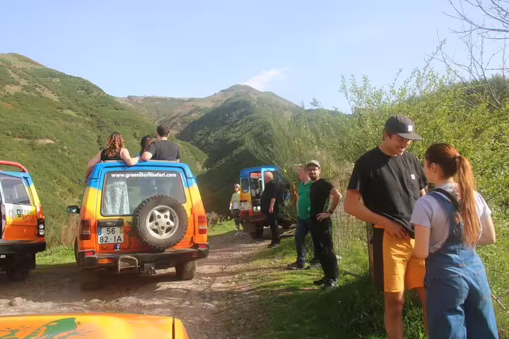 Group enjoying a 4x4 Jeep adventure with scenic mountain views, part of the Wine Flavours & Skywalk tour.