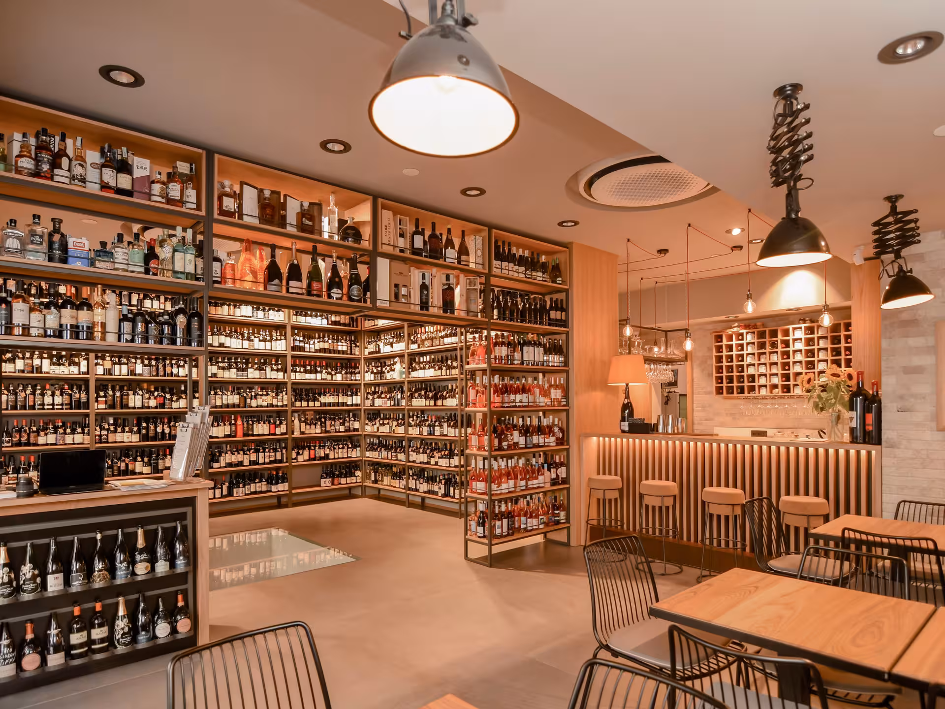 Modern wine bar in Bari city center showcasing extensive selection of wines for tasting and pairing.