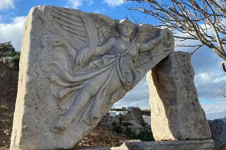 Winged Nike relief stone at Ephesus archaeological site on private Ephesus and House of Virgin Mary tour with lunch