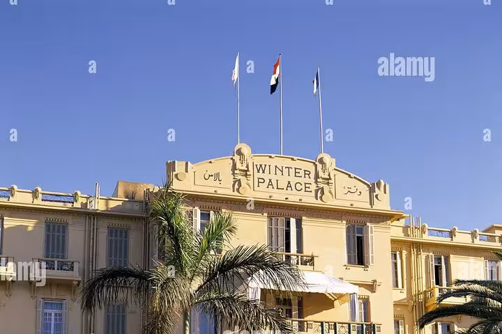 Winter Palace Hotel Luxor exterior with flags, a landmark stop on a private horse carriage tour around Luxor