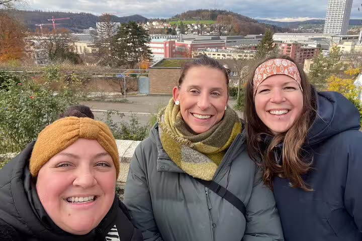 Smiling group at Winterthur hilltop viewpoint on a self-guided scavenger hunt and sightseeing tour