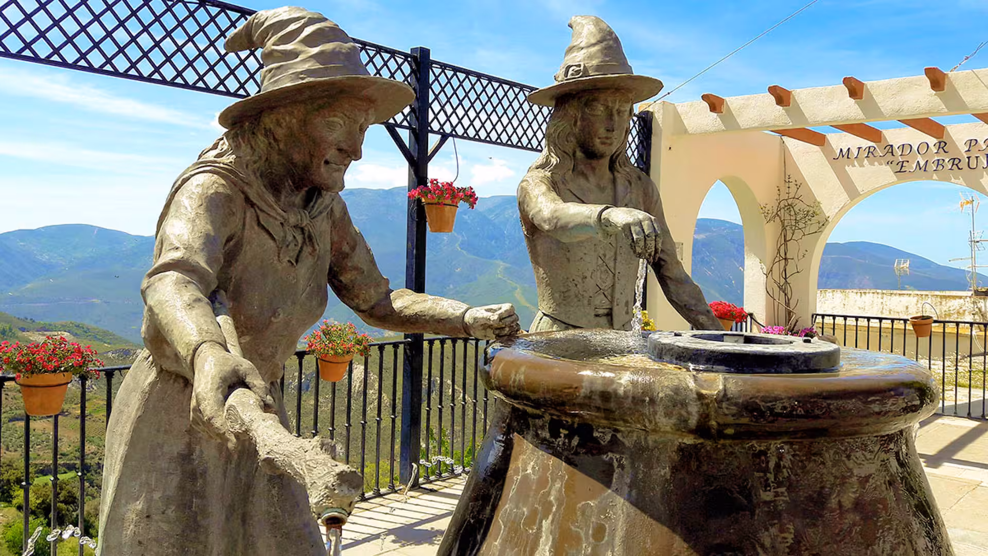 Enchanting witch sculptures at Soportújar's Mirador Embrujo, offering panoramic views of the Alpujarra mountains.