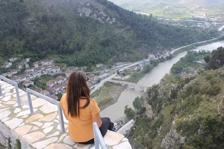 Woman admires the breathtaking view of Berat and the Osum River on the Tirana to Berat tour.