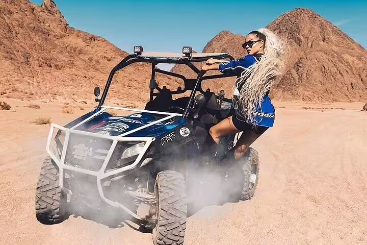 Woman posing on off-road buggy in Sinai desert, family buggy safari tour from Sharm El Sheikh