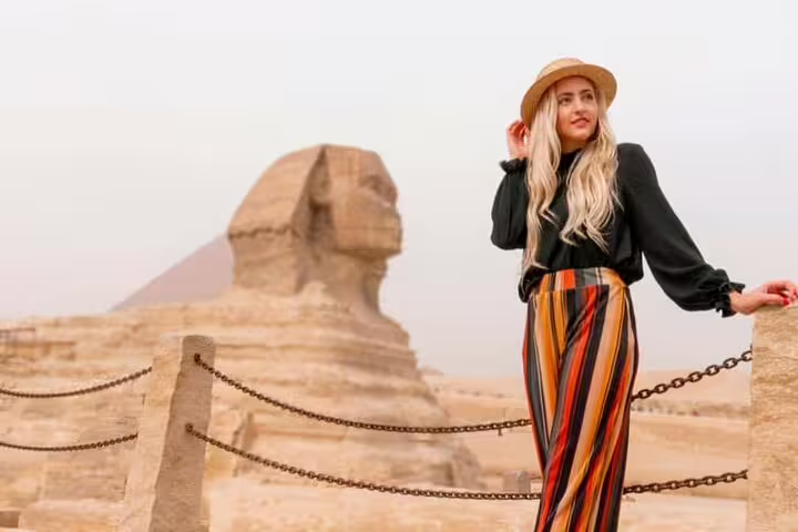 Woman near the Great Sphinx and Giza Pyramid on Port Said day trip, Egypt tour with Nile River lunch