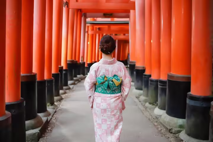 Woman in kimono at Fushimi Inari shrine torii gates, Kyoto private vacation photographer portrait photo session